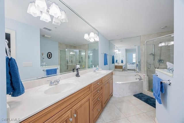 bathroom featuring tile patterned floors, vanity, and shower with separate bathtub