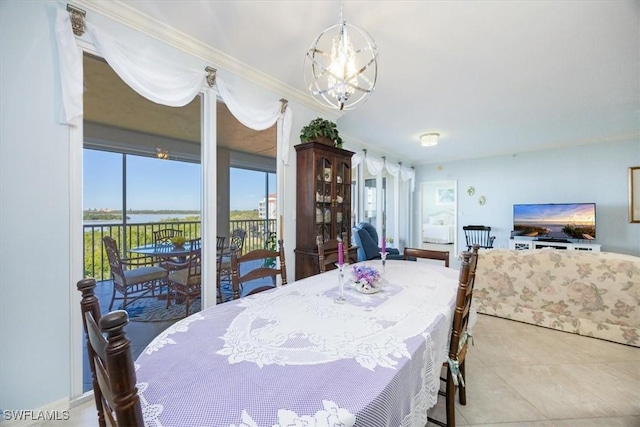 dining space featuring light tile patterned floors, an inviting chandelier, and crown molding