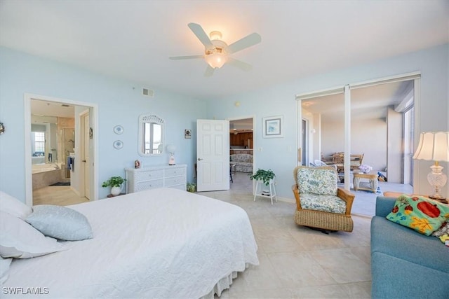 bedroom featuring ceiling fan, light tile patterned flooring, and ensuite bathroom