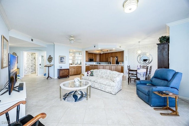 living room featuring ceiling fan and ornamental molding