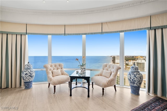 sunroom / solarium with a water view