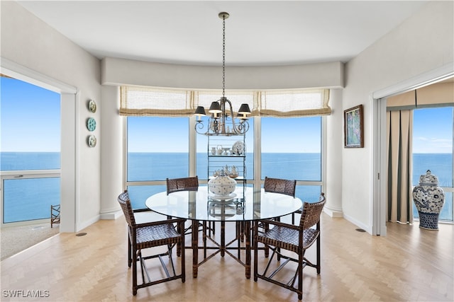 dining room with a water view and plenty of natural light