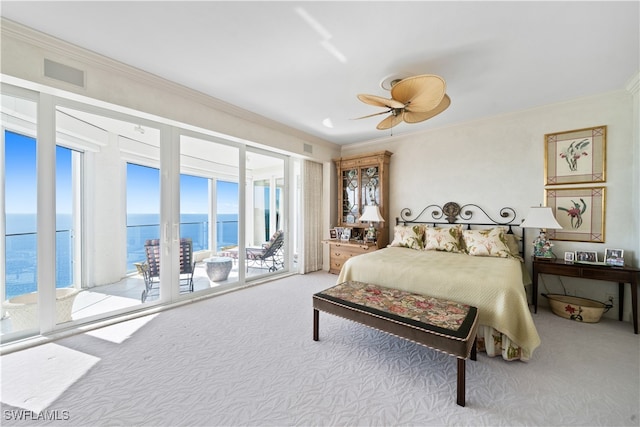 bedroom featuring access to exterior, ceiling fan, a water view, and light carpet