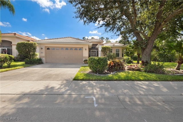 2050 Palo Duro Blvd, North Fort Myers, FL 33917 - mediterranean / spanish house with a tiled roof, an attached garage, stucco siding, and driveway