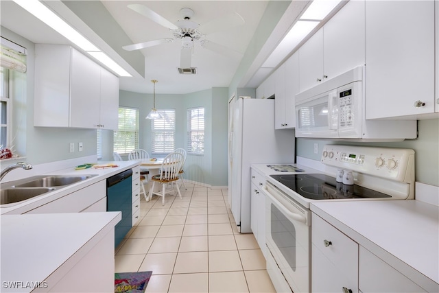 kitchen featuring white cabinets, sink, white appliances, and hanging light fixtures