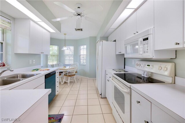 2050 Palo Duro Blvd, North Fort Myers, FL 33917 - kitchen featuring white appliances, a sink, light countertops, and white cabinetry