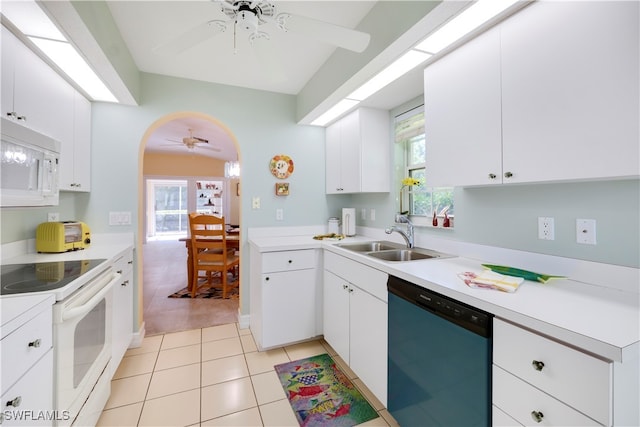 kitchen with plenty of natural light, sink, white cabinets, and white appliances