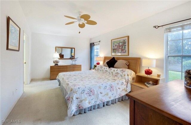 2050 Palo Duro Blvd, North Fort Myers, FL 33917 - bedroom with multiple windows, carpet flooring, and a ceiling fan