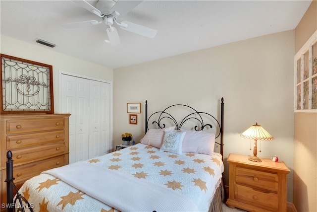 bedroom with ceiling fan and a closet