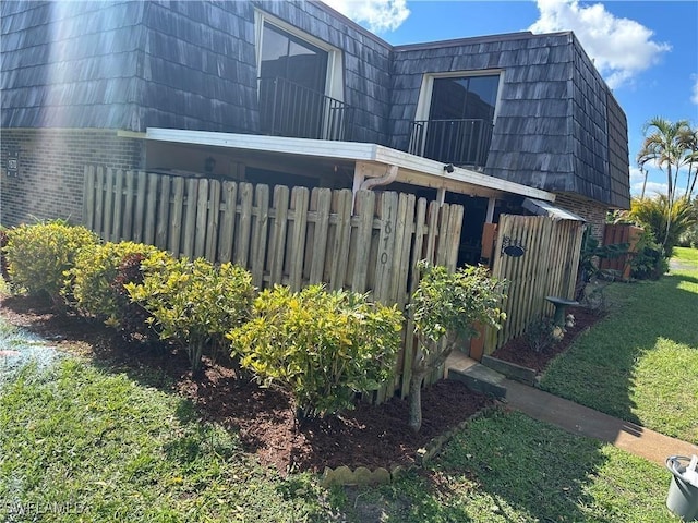 view of property exterior with a yard