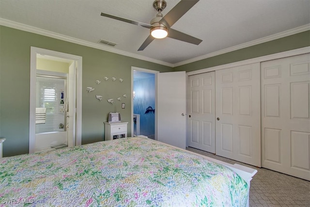 bedroom featuring ornamental molding, ensuite bathroom, and ceiling fan