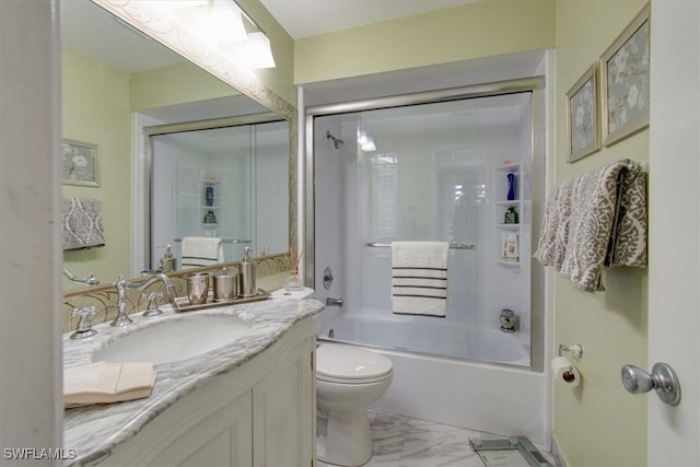 full bathroom featuring toilet, vanity, and shower / bath combination with glass door