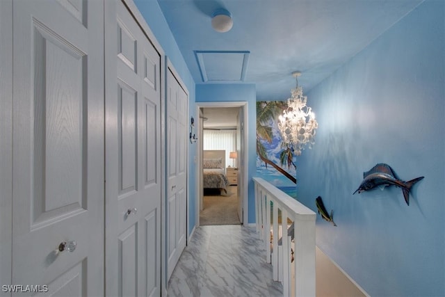 hall featuring a chandelier and light carpet