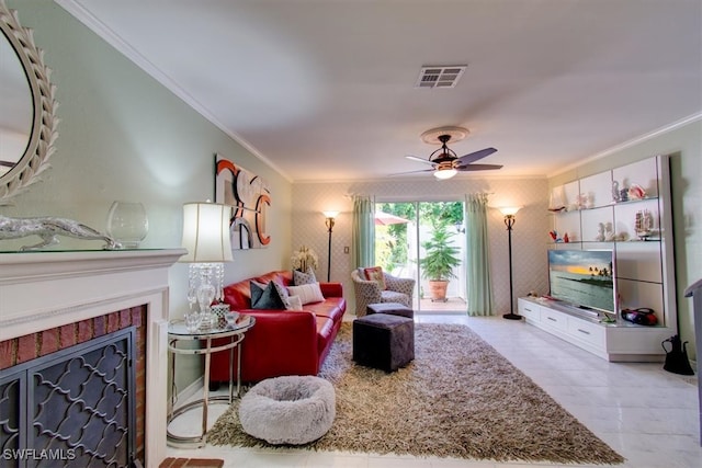 living room with ceiling fan and crown molding