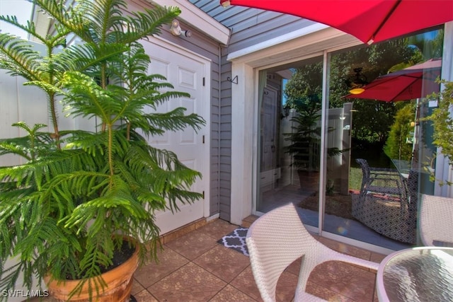 doorway to property featuring a patio area