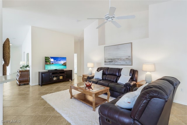 tiled living room with ceiling fan