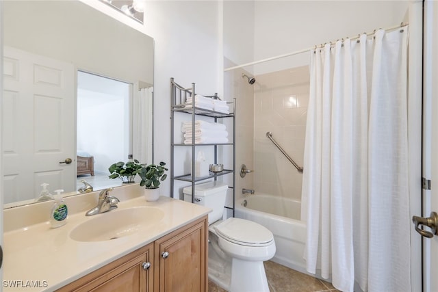 full bathroom featuring toilet, vanity, tile patterned flooring, and shower / bath combo with shower curtain