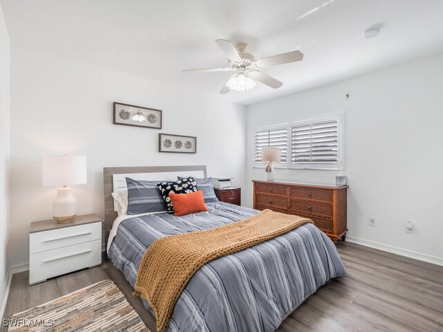 bedroom with ceiling fan and light wood-type flooring