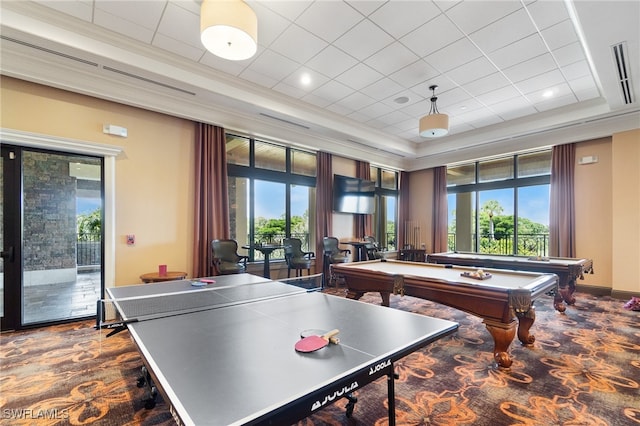 playroom featuring billiards, a healthy amount of sunlight, and a tray ceiling