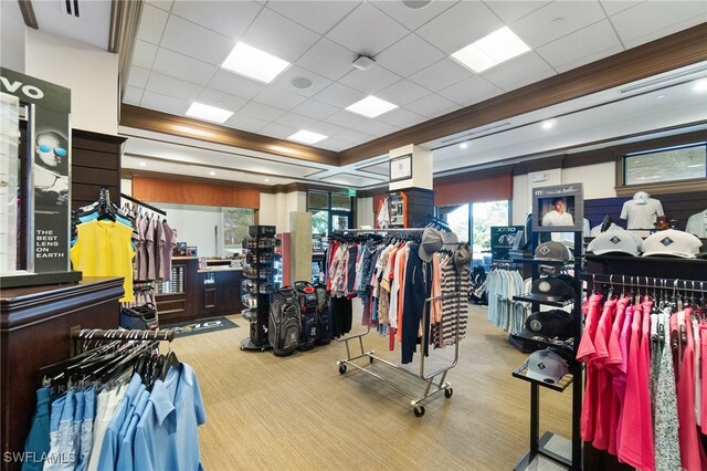 workout area featuring a paneled ceiling and carpet flooring