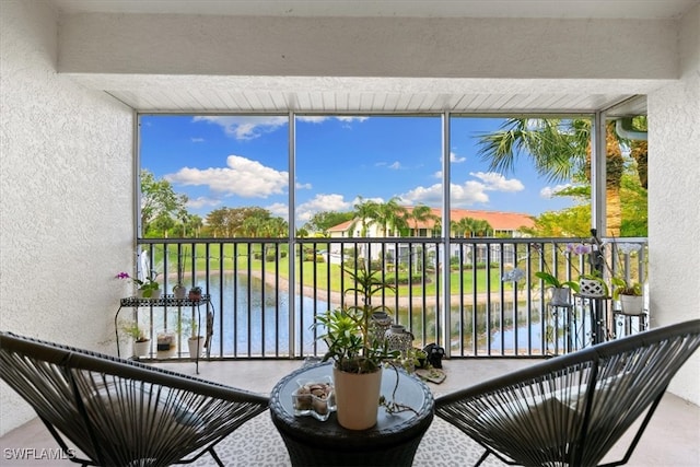 balcony featuring a water view