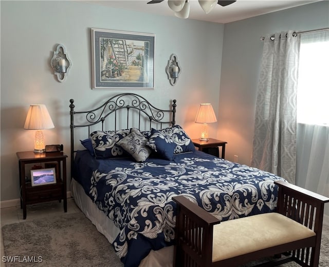 carpeted bedroom with ceiling fan