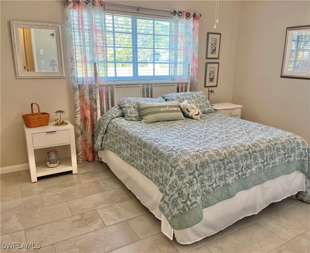 tiled bedroom with baseboards