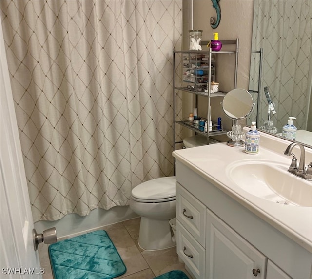 full bathroom featuring tile patterned floors, vanity, toilet, and shower / tub combo