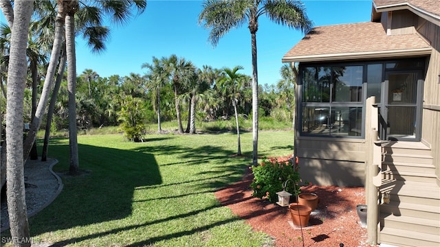 view of yard with a sunroom