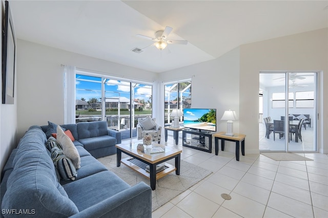 tiled living room with ceiling fan