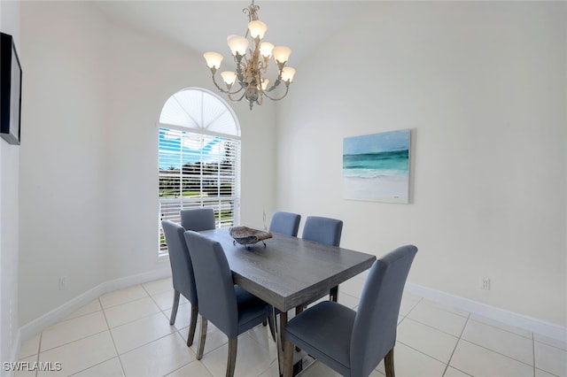 tiled dining space with a notable chandelier