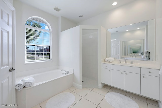 bathroom featuring separate shower and tub, tile patterned flooring, and vanity