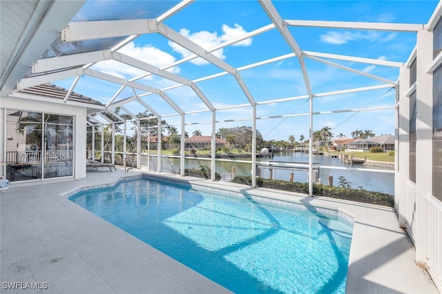 view of pool featuring a lanai, a patio, and a water view