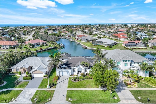 birds eye view of property featuring a water view