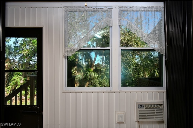 interior space featuring a wall mounted AC and plenty of natural light