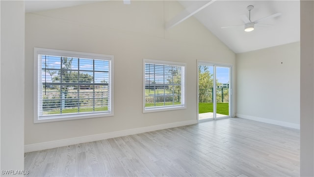 unfurnished room featuring high vaulted ceiling, a wealth of natural light, beamed ceiling, and light hardwood / wood-style floors