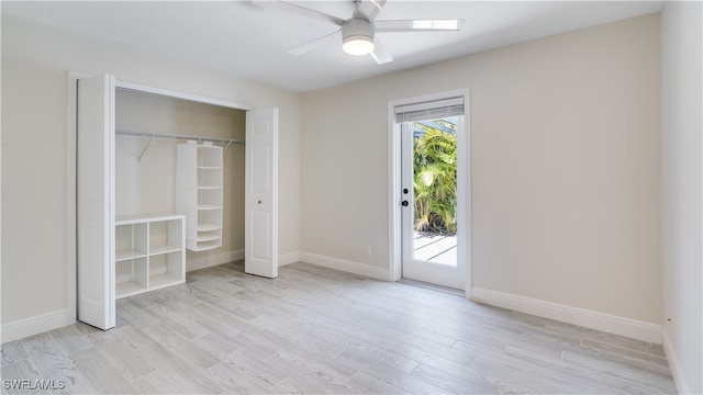 unfurnished bedroom with a closet, access to outside, ceiling fan, and light hardwood / wood-style flooring