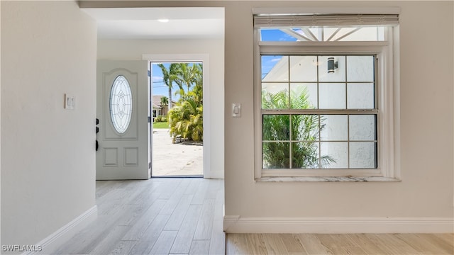 foyer entrance with light wood-type flooring