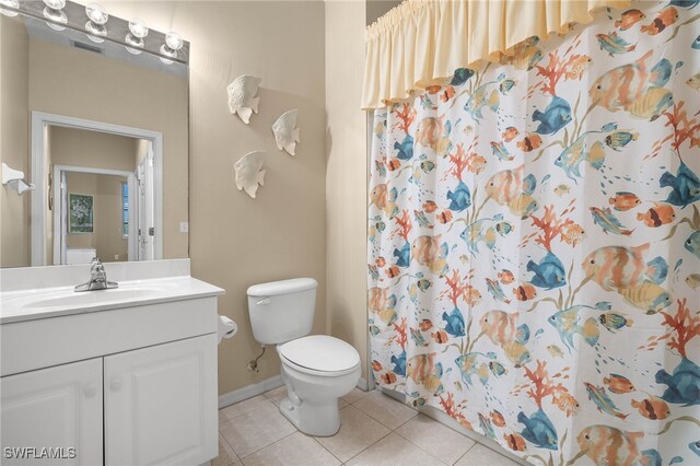 bathroom with vanity, a shower with shower curtain, tile patterned flooring, and toilet