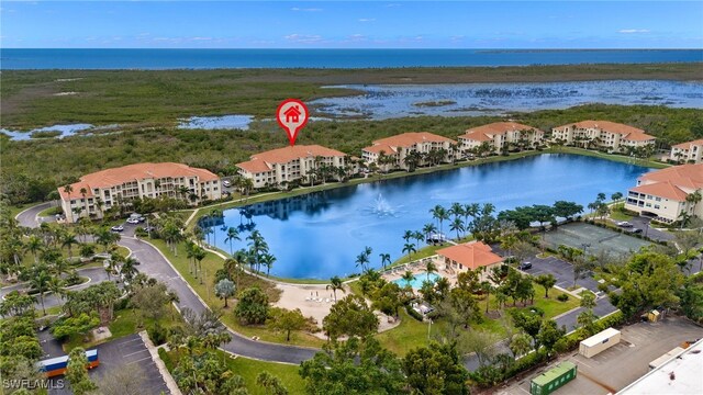 birds eye view of property featuring a water view