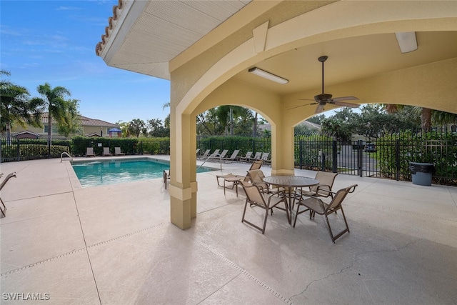 view of pool featuring ceiling fan and a patio