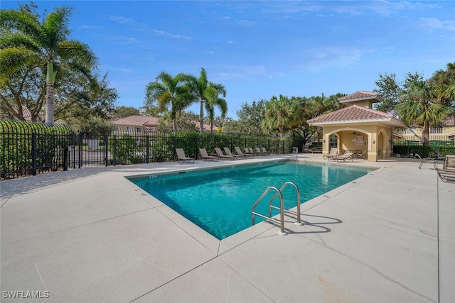 view of swimming pool featuring a patio area