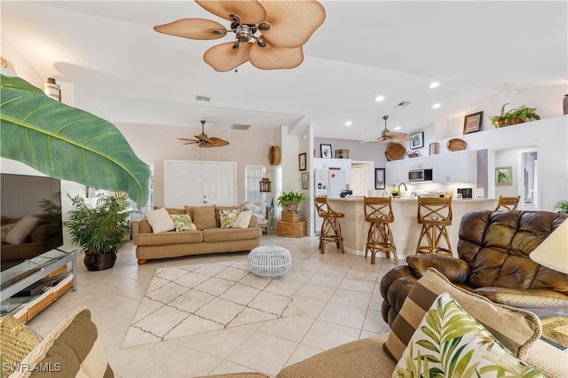 living room with light tile patterned floors and high vaulted ceiling