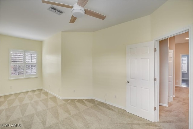 22890 Forest Ridge Dr, Estero, FL 33928 - unfurnished room with light carpet, a ceiling fan, and baseboards