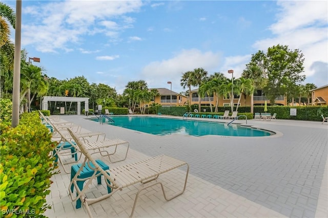 22890 Forest Ridge Dr, Estero, FL 33928 - community pool featuring a pergola and a patio