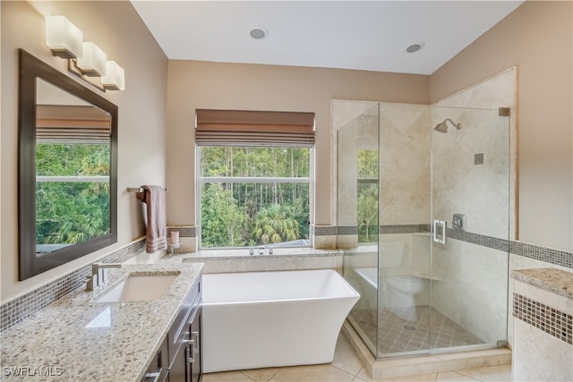 bathroom with tile patterned flooring, radiator heating unit, plenty of natural light, and independent shower and bath