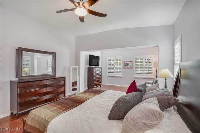 bedroom featuring vaulted ceiling, light hardwood / wood-style flooring, and ceiling fan