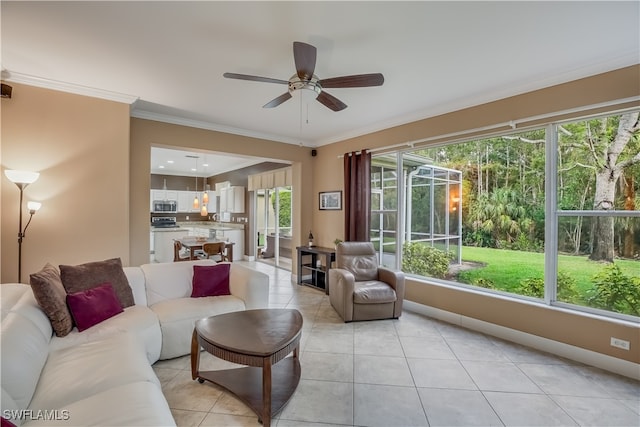 living room with ceiling fan, light tile patterned floors, and crown molding