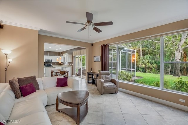 22890 Forest Ridge Dr, Estero, FL 33928 - living area with ceiling fan, healthy amount of natural light, light tile patterned floors, ornamental molding, and baseboards