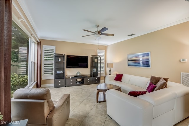 tiled living room featuring ceiling fan and ornamental molding